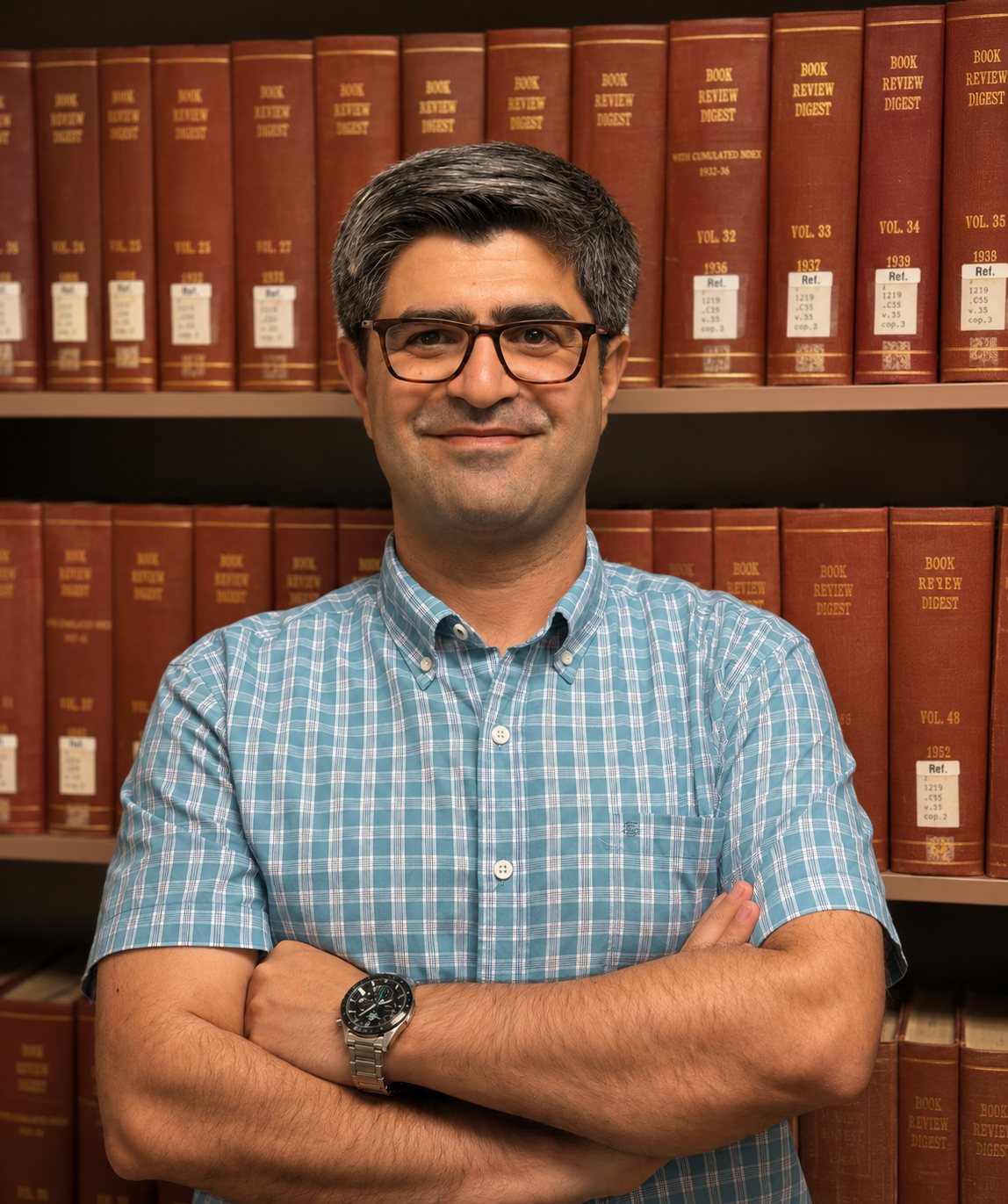Portrait of Fateh Saeidi in a library